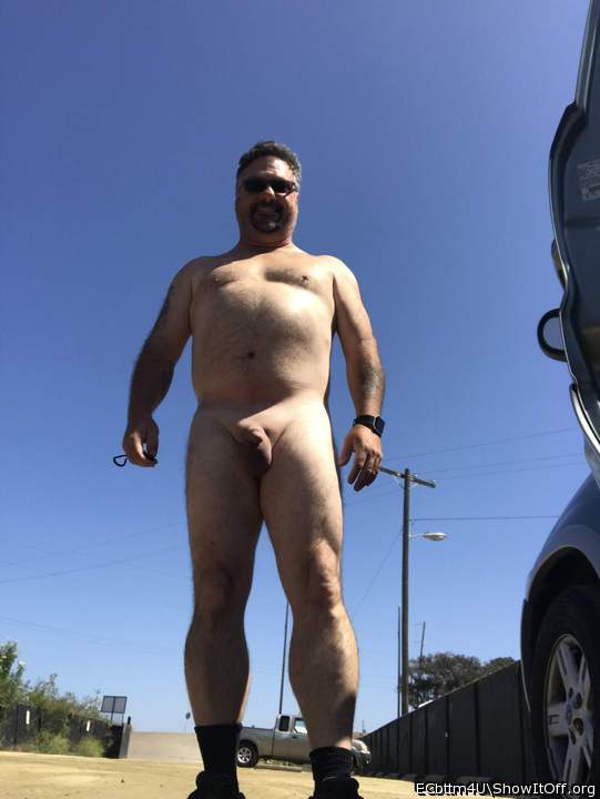 Nude in a public parking lot