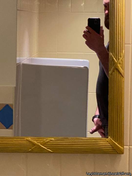 Mirror placement in view of urinal