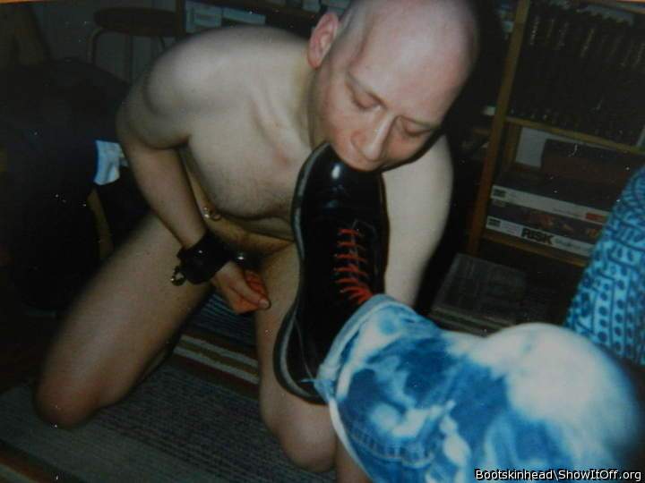 Skinhead slave eating masters boots