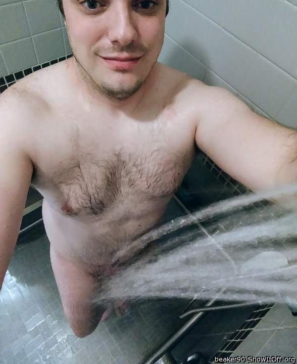 A sexy man enjoying a shower and letting us enjoy it too; 