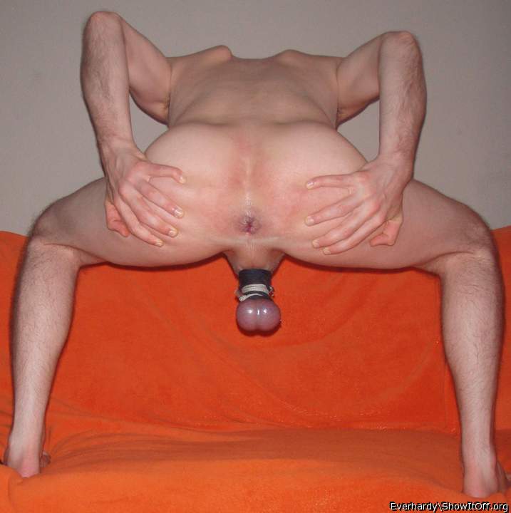 Stretching shaved asshole with tied balls
