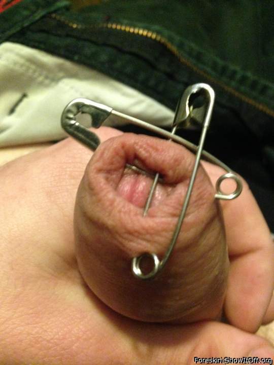 Cross of safety pins through my foreskin