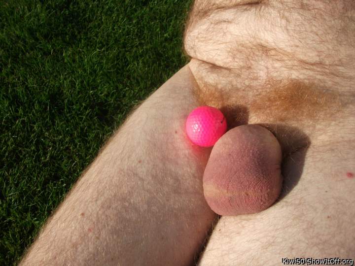 A golf ball with my balls out in the sun.