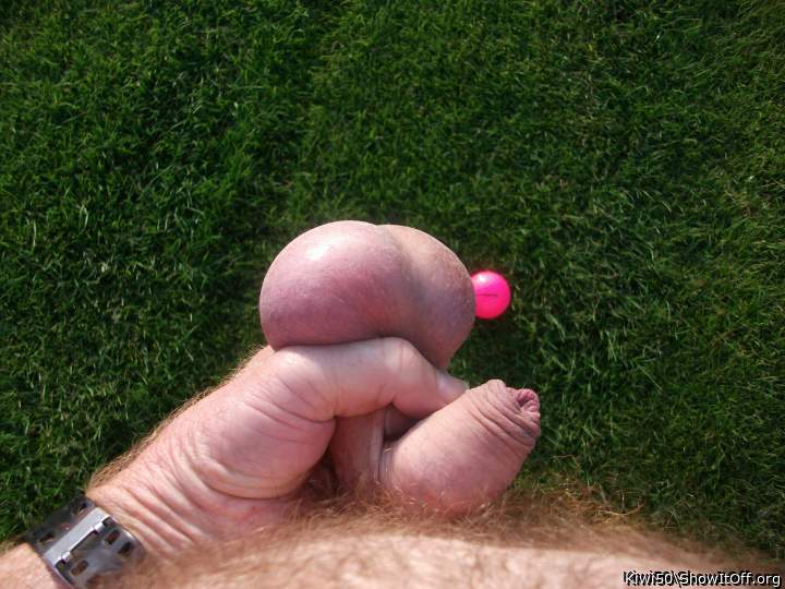 A golf ball with my balls out in the sun.