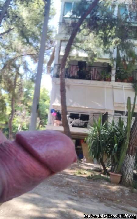 Public flashing on the woman on the balcony with great ass inside a short dress