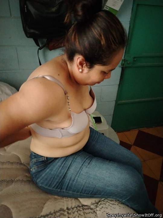 Taking her bra off