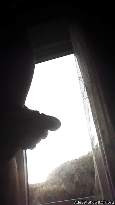 Peeking out the window between wanks!.