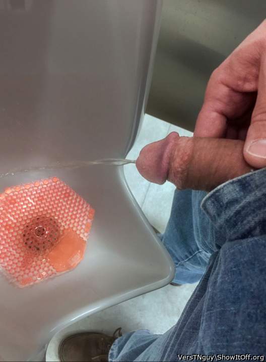 Pissing at urinal