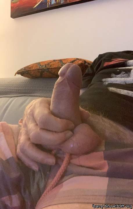 Cock in hand.