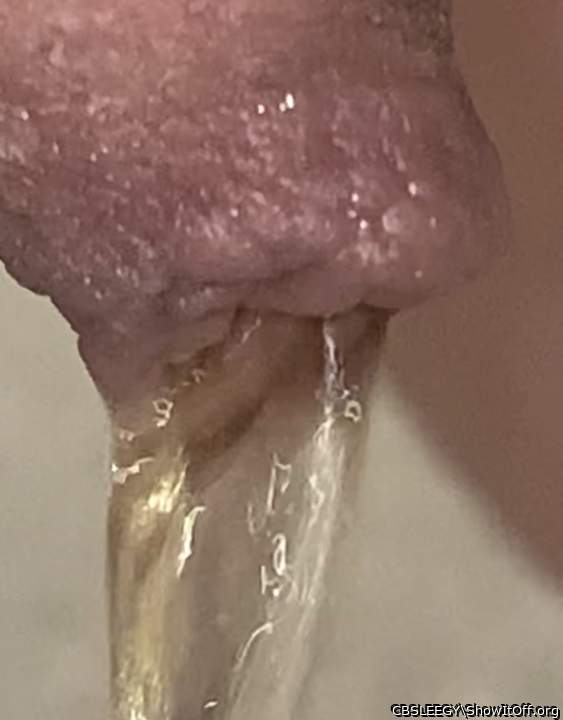 Pissing through foreskin closeup 1