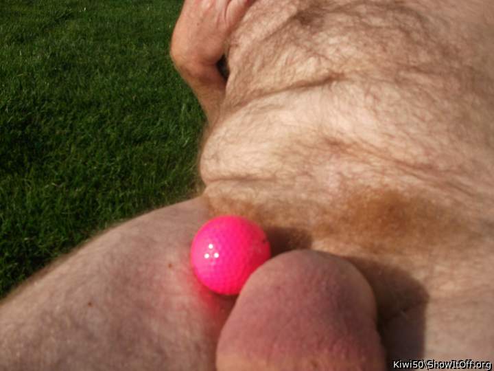 A golf ball with my balls out in the sun.
