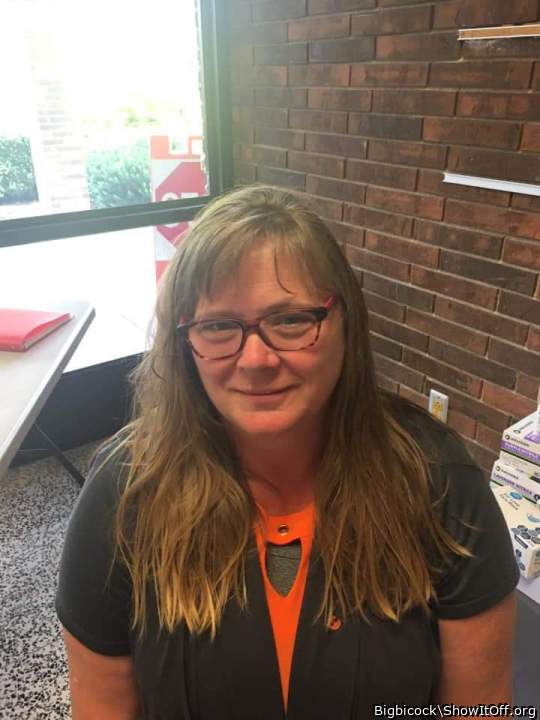 Robin with her clothes on in her classroom